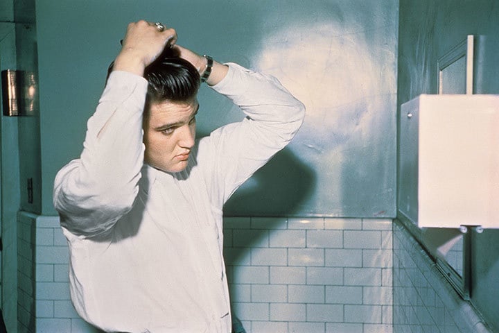 Elvis combing his hair